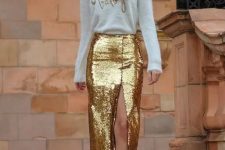 a gold sequin pencil midi skirt with a front slit is a fabulous piece to wear with a neutral top and gold shoes