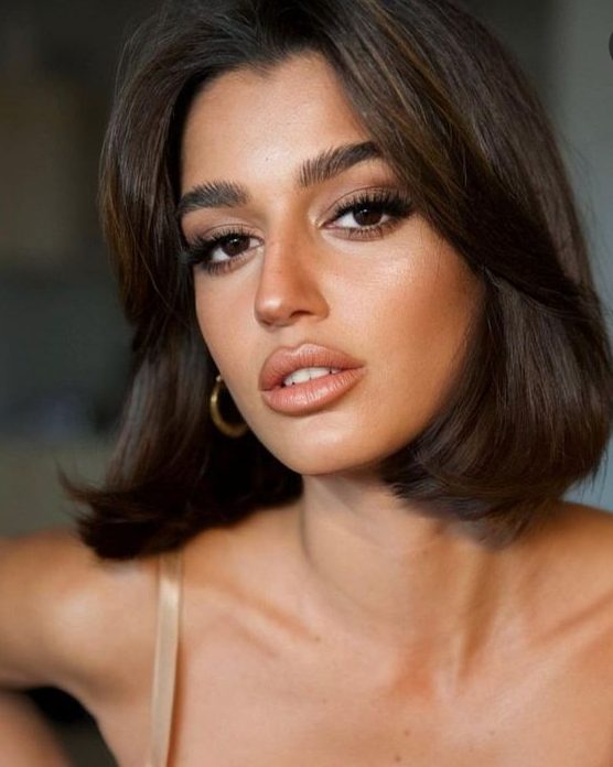 a gorgeous dark brown liquid bob with central parting and side bangs plus wavy ends is a sexy idea