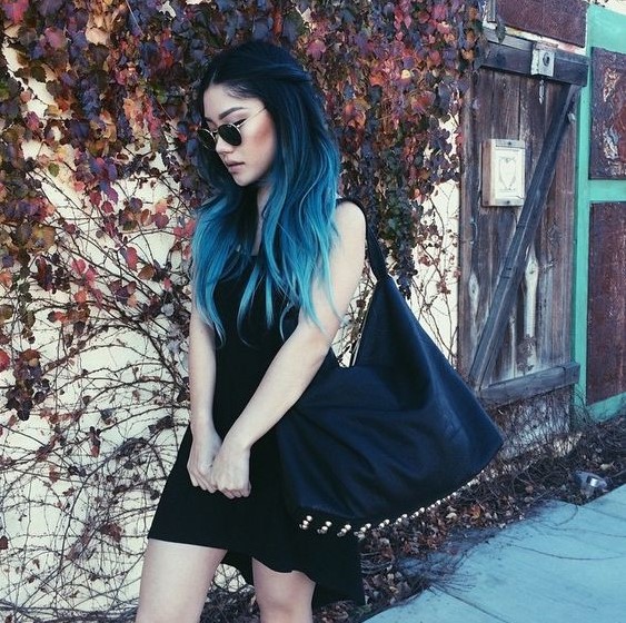 a gorgeous rock-inspired long layered haircut with black to turquoise ombre