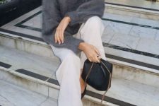a grey angora sweater, white trousers, black pointed shoes and a black bag with chain for a quiet luxury look