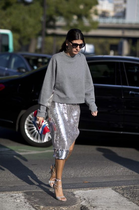 a grey sweatshirt, a silver sequin midi skirt and silver lacing up shoes is a stylish and refined outfit