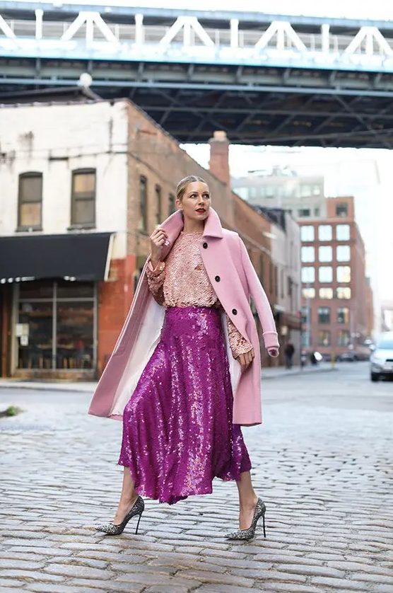 A hot pink sequin A line midi asymmetric skirt is a bold and very glam idea to try