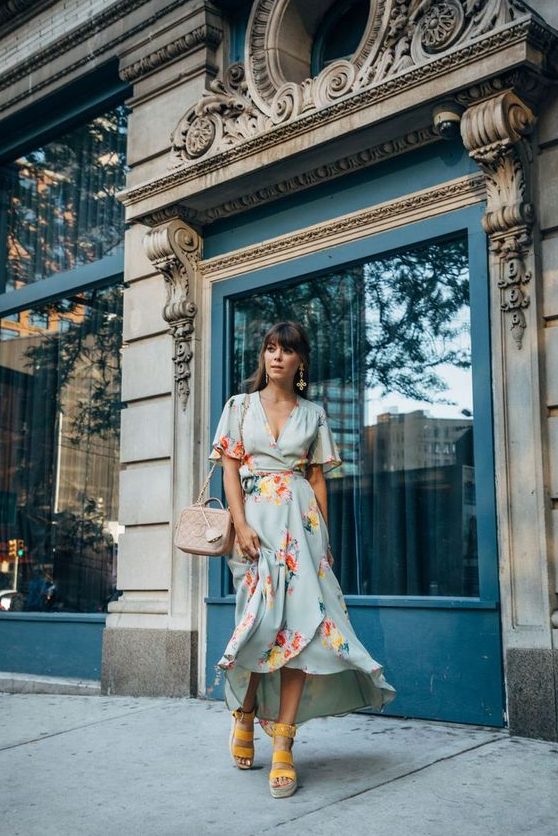 a light blue floral midi wrap dress, yellow platform shoes and a blush box bag for a bright look