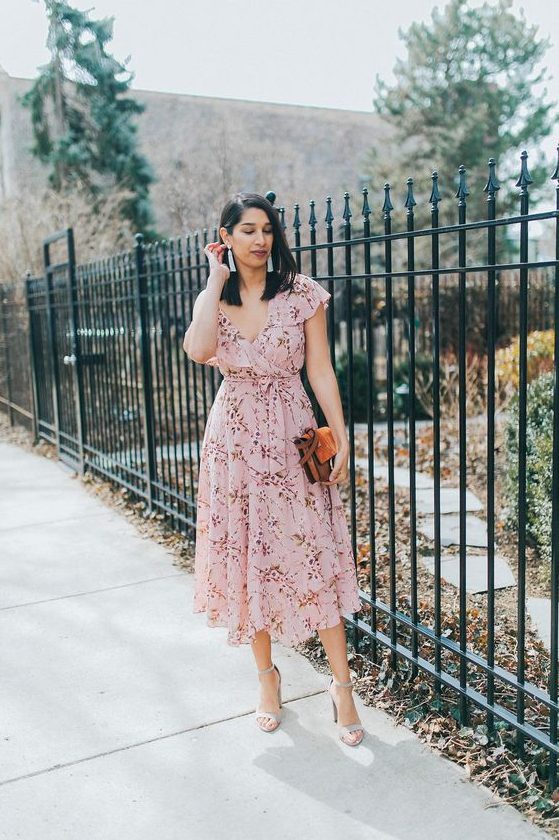 a light pink floral wrap midi dress with ruffle cap sleeves, grey shoes and a brown bag