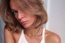 a lob with textured ends, like this one, will help inject volume into fine strands, add longer curtain bangs to frame the face