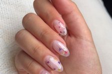 a lovely blush semi-sheer manicure decorated with colorful dried flowers is a fantastic idea for a bride