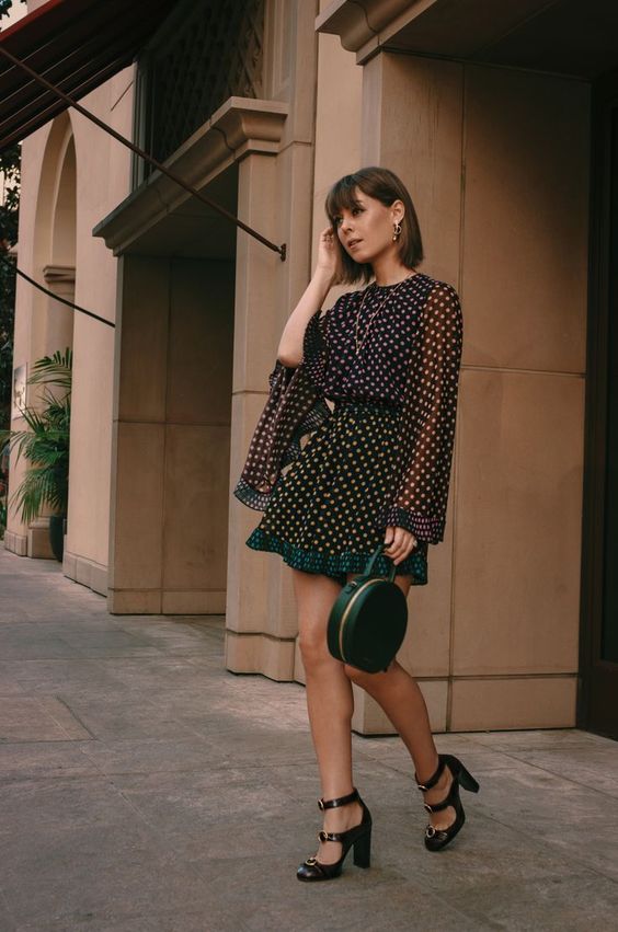 a lovely feminine look with a polka dot mini dress, Mary Jane shoes and a green round bag is chic and cute