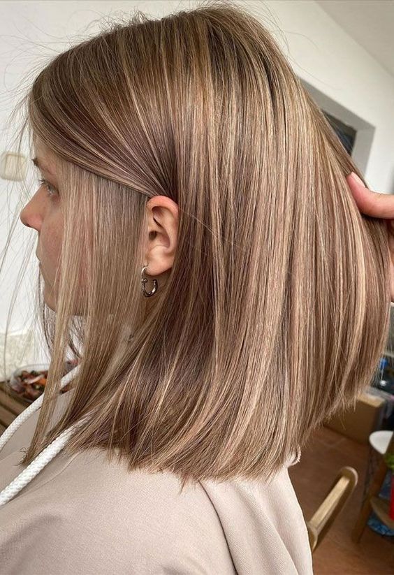 a lovely light brown long bob with straight hair looks chic and elegant and never goes out of style