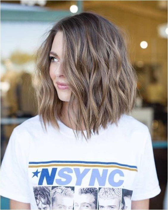 a lovely light brown wavy long bob with some highlights is a cool idea to wear any time, it's always on top