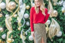 a red turtleneck sweater, a gold sequin knee skirt with a side slit, black shoes with metallic heels