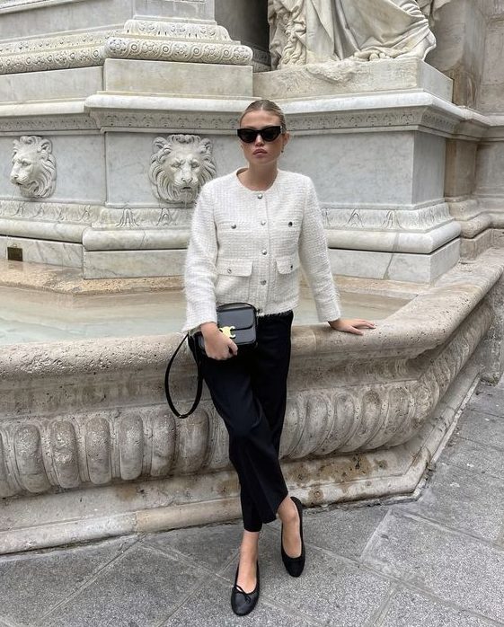 a refined black and white outfit with a cropped blazer, black trousers, black flats and a bag feels like old money