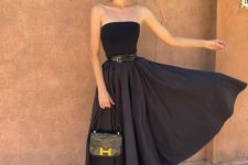 a refined special occasion look with a strapless top, a full skirt with a belt, black embellished and a small bag
