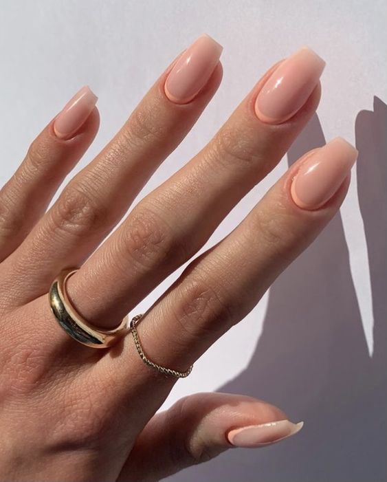 a reverse French manicure with Peach Fuzz touches is a cool idea for spring and summer