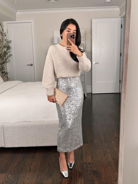 a shiny pre-wedding party look with a neutral jumper, a silver sequin maxi, silver shoes and a nude clutch
