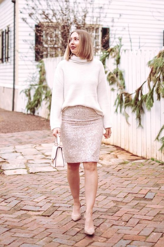 a simple and glam look with a white turtleneck, a shiny blush sequin knee skirt, nude shoes and a white bag