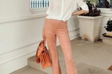 a spring work outfit with a white button down, Peach Fuzz flare pants, an orange bag is awesome and simple