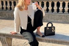 a stylish old money outfit with a black top, pants, a white cropped blazer, two-tone flats and a black bag