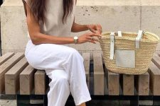 a summer outfit with a sleeveless top, white jeans, black flats with bows and a basket bag is amazing