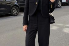 a total black old money look with a top, trousers, a cropped blazer, two-tone shoes and a small bag for fall or winter