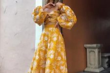 a two piece midi dress with an off the shoulder knot top with puff sleeves, a high waisted A-line skirt, strappy shoes for a summer wedding guest look