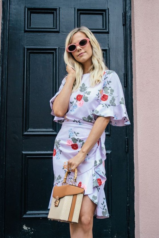 a white floral print over the knee dress with ruffled sleeves and a high neckline, a box bag and sunglasses