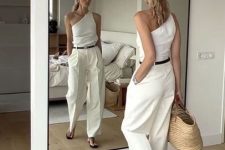 a white one shoulder top, white wideleg pants, flipflops and a woven bag compose a summer quiet luxury look