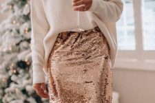 a white oversized jumper, a rose gold sequin midi pencil skirt and statement earrings for the holidays