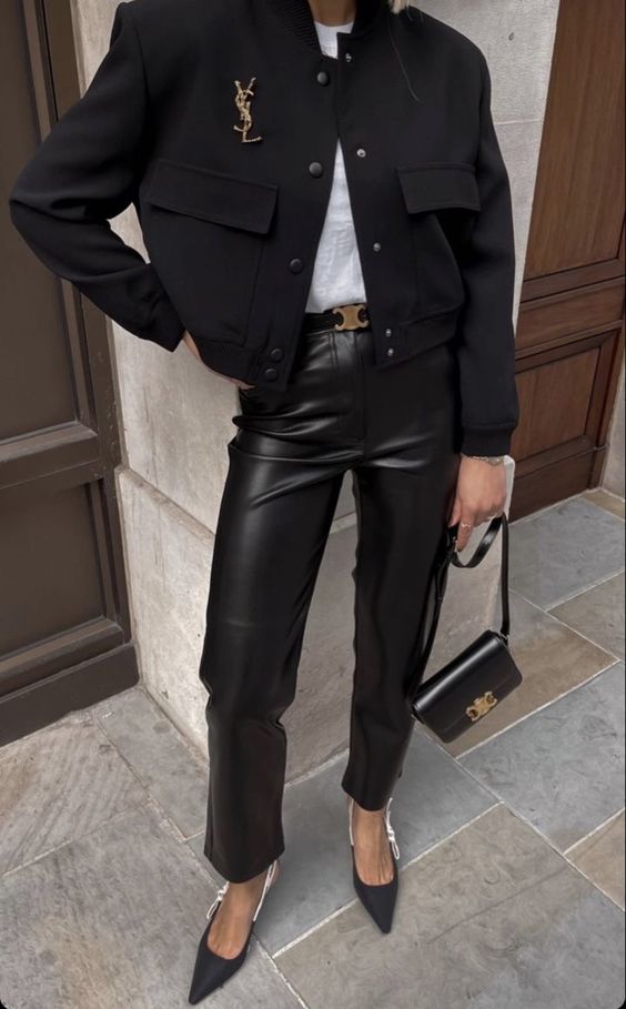 A white t shirt, black leather trousers, a black cropped blazer, black slingbacks and a small black bag with gold details