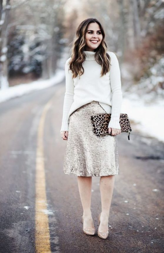 A white turtleneck sweater, a silver sequin A line skirt, nude shoes and a leopard printed clutch