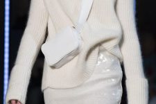 a white turtleneck sweater, a white sequin skirt and a small crossbody bag for a beautiful holiday look