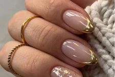 almond nails with shiny gold tips and an accent nail done with gold foil are amazing for a glam look, they add a touch of shine