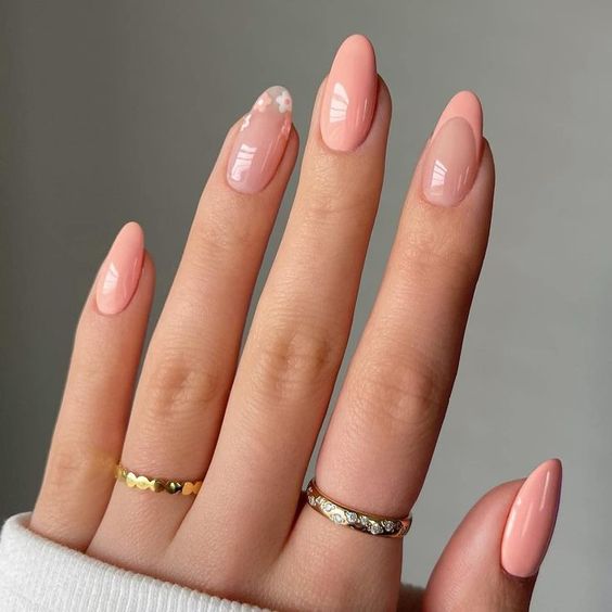 almond-shaped Peach Fuzz nails with an accent floral and French finger are a cool and delicate idea