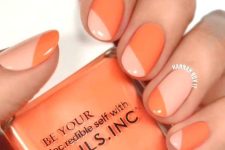 almond-shaped nails with a color block effect, with orange and peachy pink are a bold idea for summer