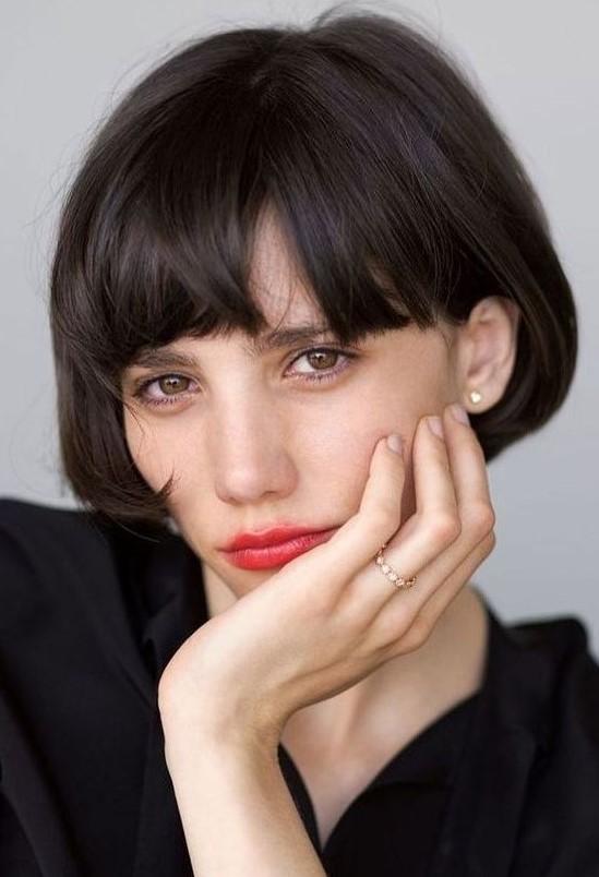 an ear-length bob with a classic fringe in black is a beautiful Parisian chic infused hairstyle