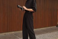 an every day quiet luxury look with a black t-shirt, high waisted pants, minimal nude kitten heels and a small bag
