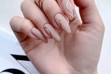 an ultra-modern wedding manicure with matte nude nails and gold abstract lines is a catchy idea for a modern and stylish look
