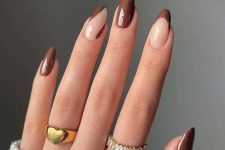 beautiful and chic long lamond nails in brown, with a French design and some abstract design, too, are great for the fall