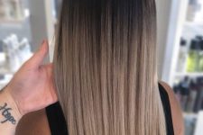 beautiful long ombre hair from black to pretty delicate blonde, with straight hair and a lot of volume