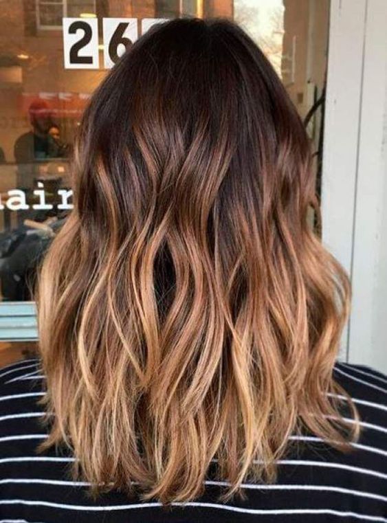 beautiful medium-length hair from dark brunette to caramel and honey blonde, with volume and waves, is a fantastic solution