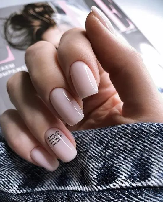 blush nails with a tiny quote on the ring finger - choose your favorite quote about love and relationships