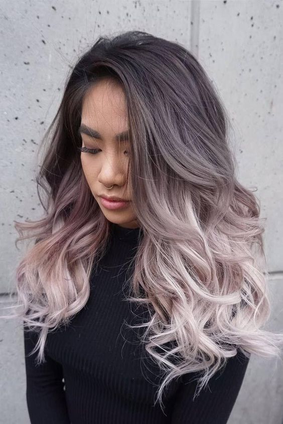 extra long and volumetric ombre hair from black to mauve and icy blonde, with volume and waves is a lvoely solution