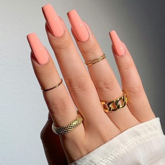 extra long coffin-shaped peachy nails are a super cool and catchy solution for a modern and bold look