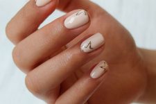 eye-catchy creamy square nails with gold stars are amazing to rock them in spring and summer, they look laconic and cool