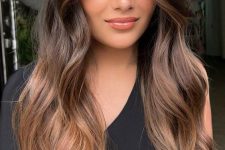 fab long hair from dark brunette to chestnut, with volume and waves, is a fantastic idea to rock right now