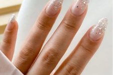 gorgeous long almond blush wedding nails with silver glitter and sparkles are amazing for a glam look