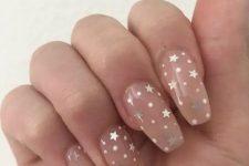 gorgeous nude nails with white polka dors and silver stars are amazing for a modern celestial bride