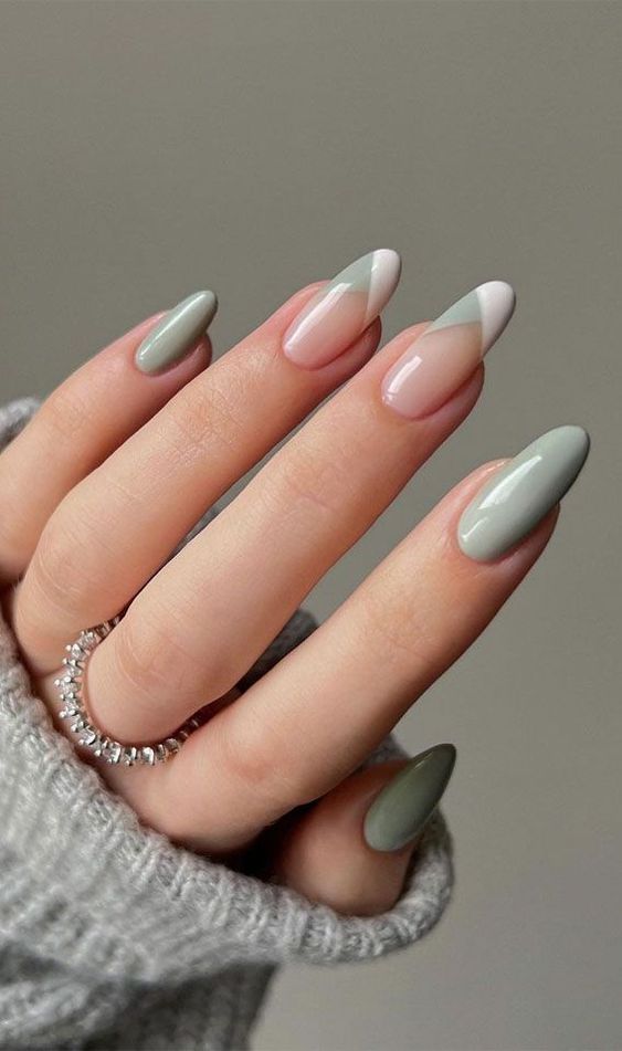 long almond nails styled for spring with mint green and white and mint French-styled tips are wow