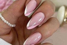 long almond-shaped nails with a fresh glam version of French manicure, with white and hot pink plus pink glitter