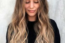 long dark hair with an ombre effect and waves, from dark brunette to bright bronde is a cool idea