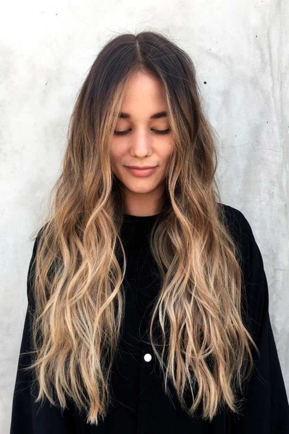 long dark hair with an ombre effect and waves, from dark brunette to bright bronde is a cool idea